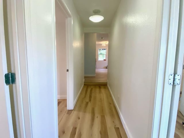 1007 Johnson St, Lockhart, TX 78644 - corridor featuring light wood-style floors and baseboards