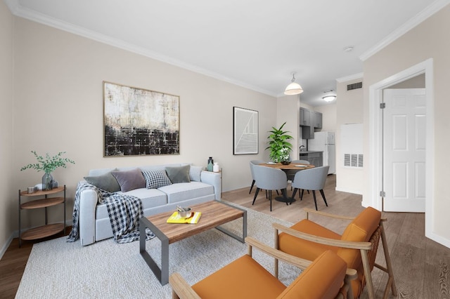 12166 Metric Blvd Unit 115, Austin, TX 78758 - living room featuring dark wood-type flooring and ornamental molding