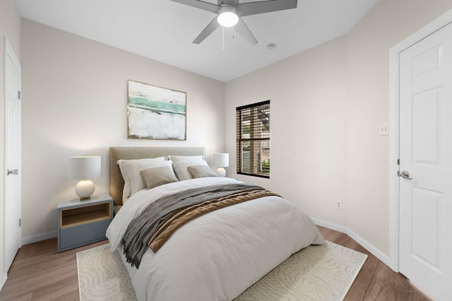 12166 Metric Blvd Unit 115, Austin, TX 78758 - bedroom with wood finished floors and a ceiling fan