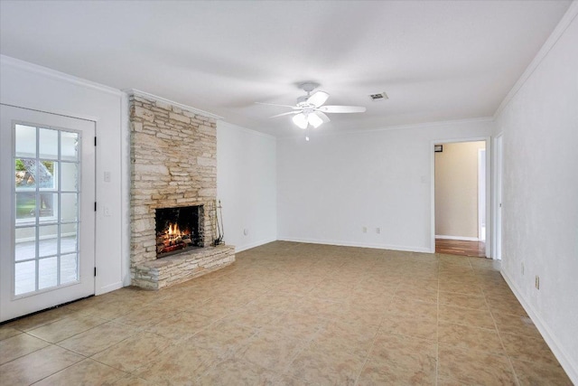 9504 Flintrock Cir, Austin, TX 78737 - unfurnished living room featuring ornamental molding, a ceiling fan, a stone fireplace, and light tile patterned floors