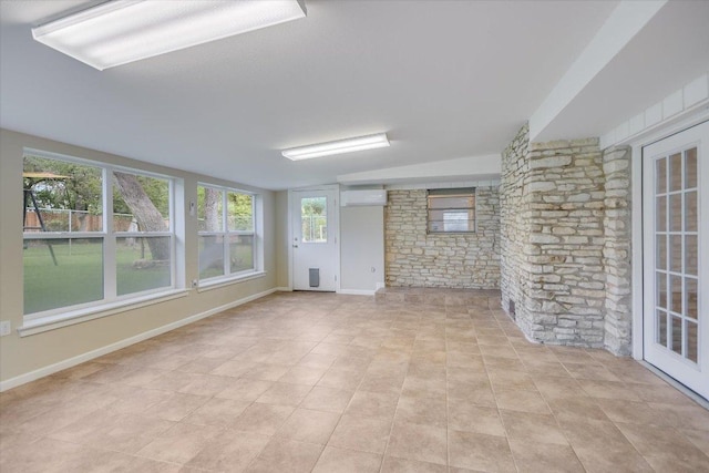 9504 Flintrock Cir, Austin, TX 78737 - unfurnished sunroom with a wall mounted AC and vaulted ceiling