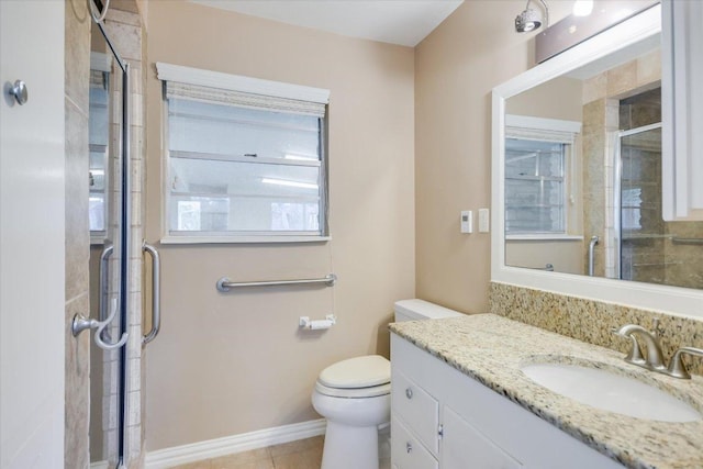9504 Flintrock Cir, Austin, TX 78737 - full bathroom featuring vanity, a shower stall, toilet, tile patterned floors, and baseboards