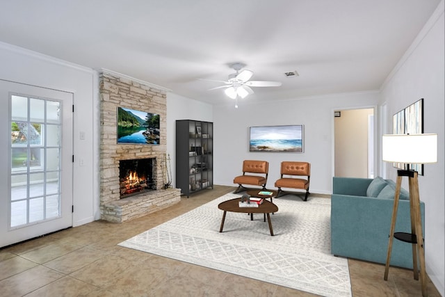 9504 Flintrock Cir, Austin, TX 78737 - living area with ornamental molding, a stone fireplace, a ceiling fan, light tile patterned flooring, and baseboards