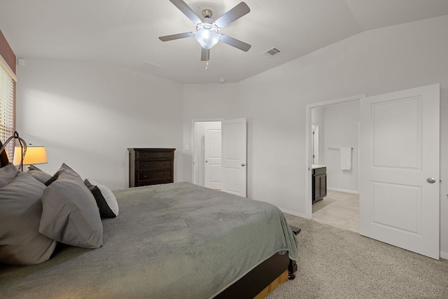 13712 Fallsprings Way, Manor, TX 78653 - bedroom with vaulted ceiling, light colored carpet, ensuite bath, ceiling fan, and baseboards