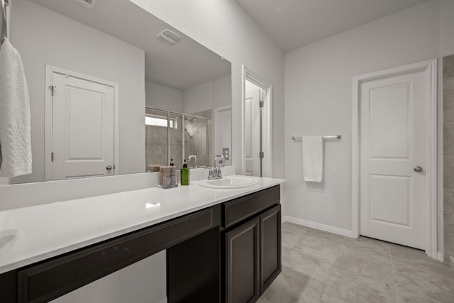 13712 Fallsprings Way, Manor, TX 78653 - bathroom featuring vanity, a stall shower, and baseboards