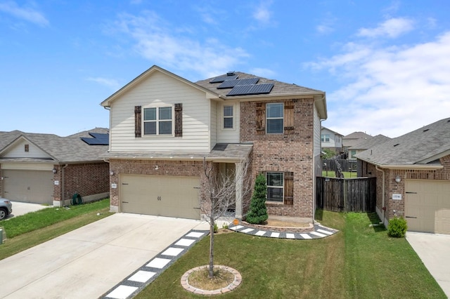 13712 Fallsprings Way, Manor, TX 78653 - traditional-style house featuring brick siding, solar panels, driveway, a garage, and a shingled roof