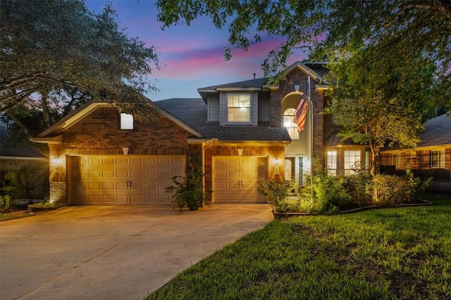 471 Crooked Crk, Buda, TX 78610 - traditional home with concrete driveway, brick siding, and a shingled roof