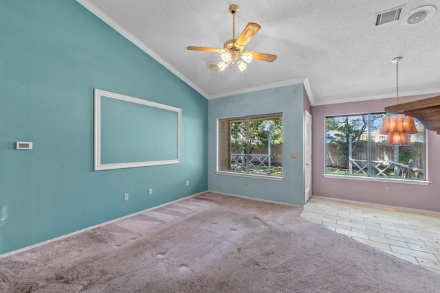 8417 Cornerwood Dr, Austin, TX 78717 - spare room with vaulted ceiling, crown molding, a ceiling fan, carpet, and a textured ceiling