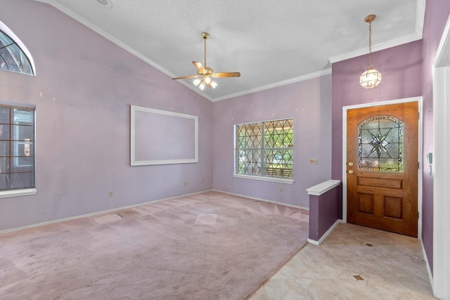 8417 Cornerwood Dr, Austin, TX 78717 - tiled foyer with crown molding, lofted ceiling, carpet floors, ceiling fan, and baseboards
