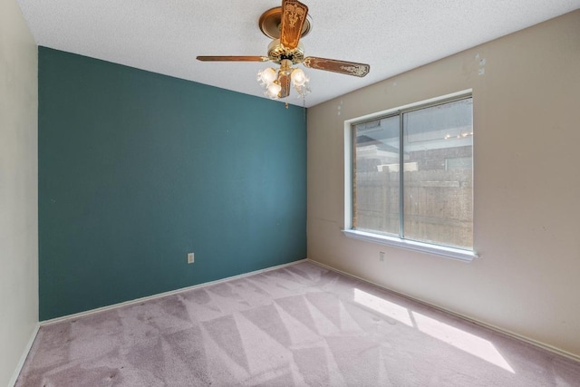 8417 Cornerwood Dr, Austin, TX 78717 - carpeted spare room with a ceiling fan, baseboards, and a textured ceiling