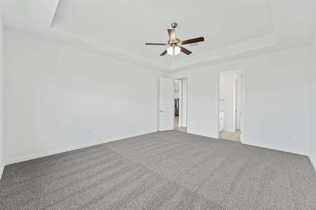 632 Deerpath St, Leander, TX 78641 - spare room with a tray ceiling, ceiling fan, carpet, and baseboards