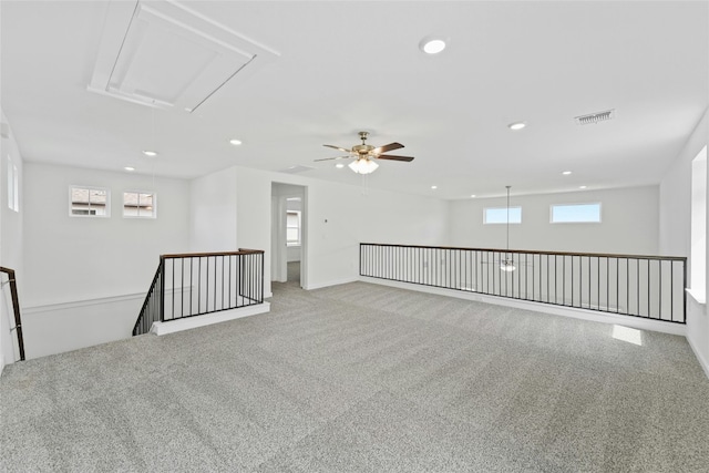 632 Deerpath St, Leander, TX 78641 - spare room featuring attic access, carpet floors, recessed lighting, ceiling fan, and baseboards