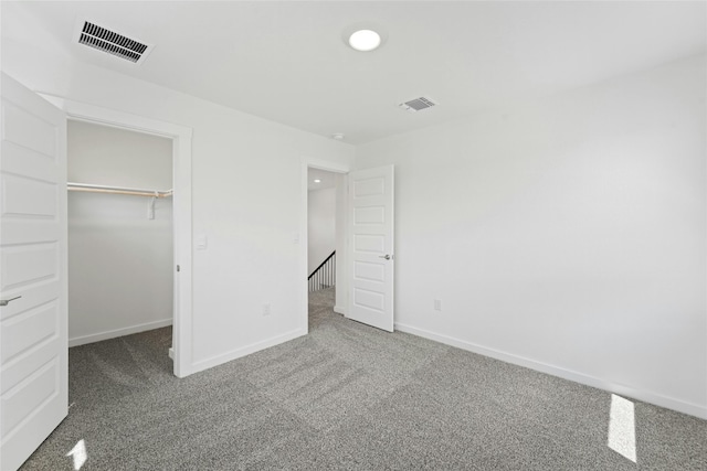 632 Deerpath St, Leander, TX 78641 - unfurnished bedroom featuring carpet flooring, baseboards, a walk in closet, recessed lighting, and a closet