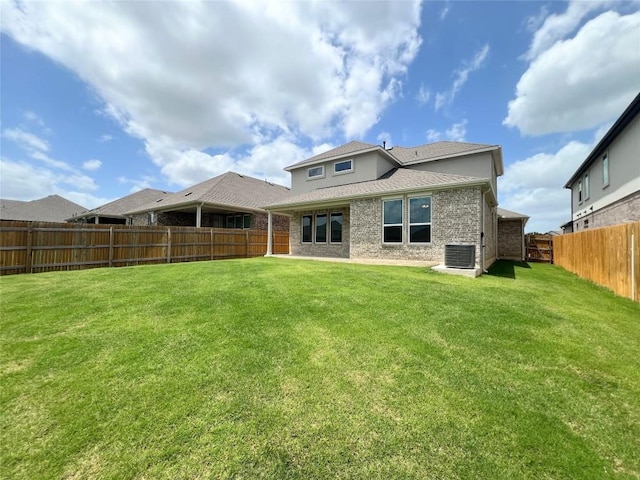 632 Deerpath St, Leander, TX 78641 - rear view of property featuring central AC, a shingled roof, and brick siding