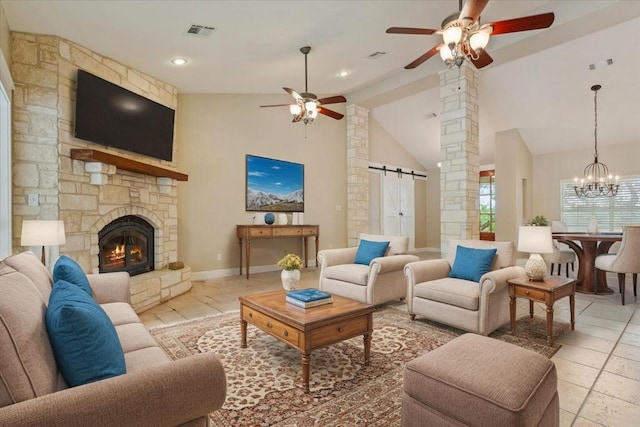 2105 Red Rock Dr, Belton, TX 76513 - living room with a ceiling fan, a barn door, ornate columns, high vaulted ceiling, and a chandelier