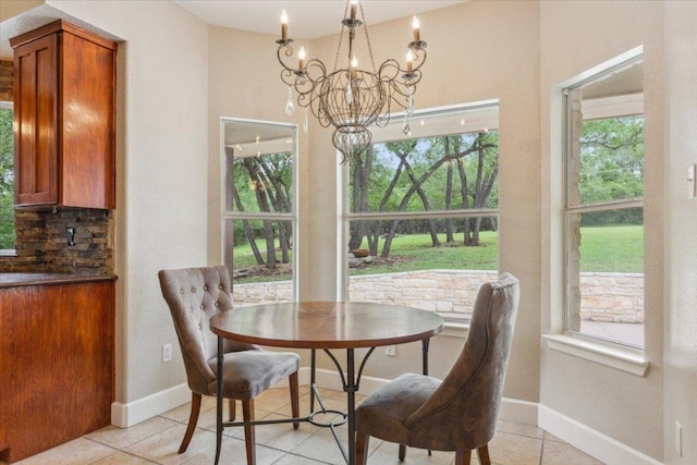 2105 Red Rock Dr, Belton, TX 76513 - dining room with a chandelier, light tile patterned flooring, and healthy amount of natural light