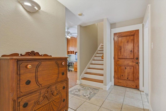 2105 Red Rock Dr, Belton, TX 76513 - foyer with stairs, ceiling fan, baseboards, and light tile patterned flooring