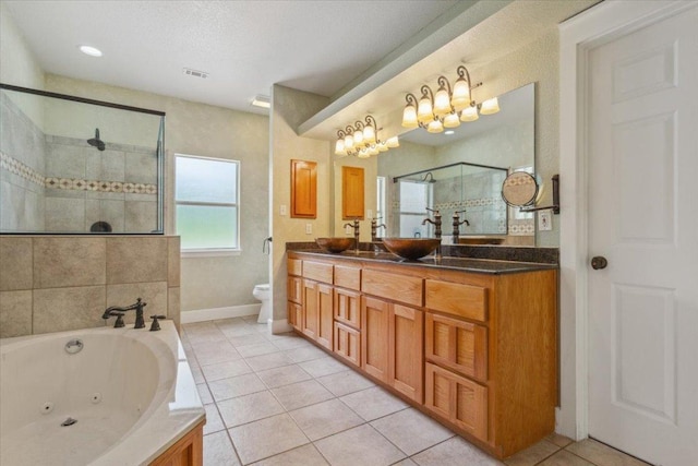 2105 Red Rock Dr, Belton, TX 76513 - full bath with tiled shower, double vanity, a jetted tub, toilet, and tile patterned flooring