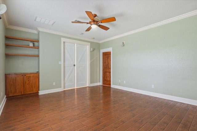 2105 Red Rock Dr, Belton, TX 76513 - unfurnished bedroom featuring crown molding, wood finished floors, baseboards, and a ceiling fan
