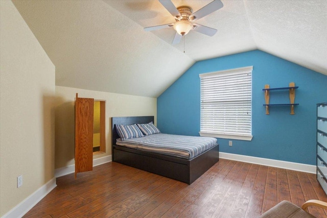 2105 Red Rock Dr, Belton, TX 76513 - bedroom with hardwood / wood-style flooring, vaulted ceiling, ceiling fan, baseboards, and a textured ceiling