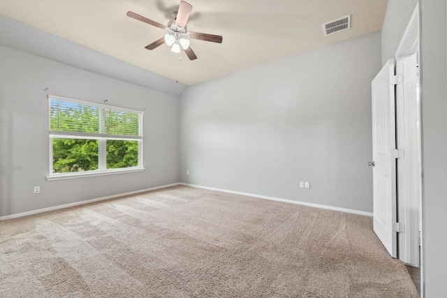 1008 Comal Run, Hutto, TX 78634 - spare room featuring carpet floors, a ceiling fan, baseboards, and lofted ceiling