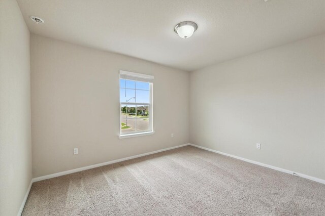 1008 Comal Run, Hutto, TX 78634 - empty room with carpet flooring and baseboards