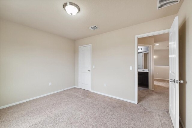 1008 Comal Run, Hutto, TX 78634 - unfurnished room with light carpet and baseboards