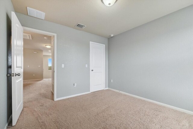 1008 Comal Run, Hutto, TX 78634 - unfurnished bedroom featuring carpet floors and baseboards