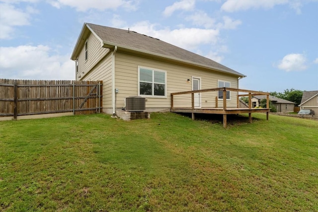 1008 Comal Run, Hutto, TX 78634 - rear view of house featuring a wooden deck and central AC unit