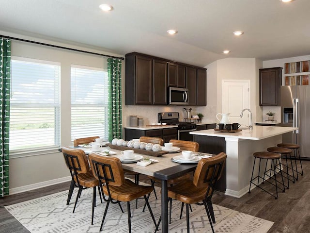 226 Red Tail Hawk Ln, Alum Creek, TX 78612 - dining area featuring wood finished floors, baseboards, recessed lighting, and vaulted ceiling