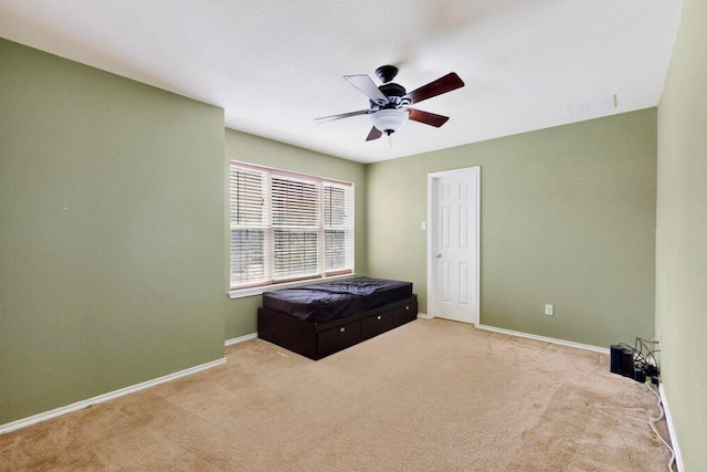952 Hometown Pkwy, Kyle, TX 78640 - unfurnished bedroom featuring carpet flooring and ceiling fan