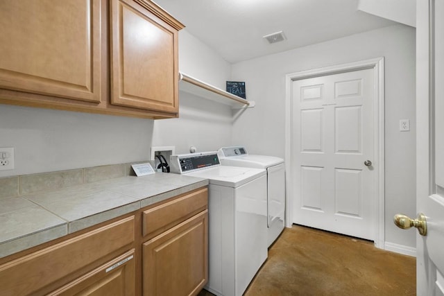 15100 General Williamson Dr, Austin, TX 78734 - washroom featuring independent washer and dryer and cabinet space