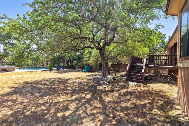 15100 General Williamson Dr, Austin, TX 78734 - view of yard with a wooden deck, a swimming pool, and stairway
