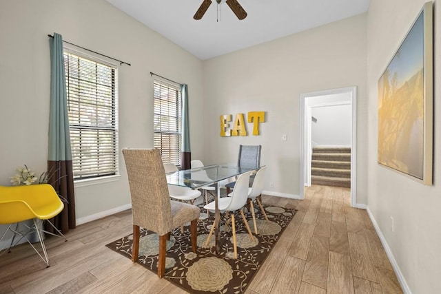 15100 General Williamson Dr, Austin, TX 78734 - dining space with wood finished floors, ceiling fan, stairs, and baseboards