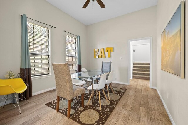15100 General Williamson Dr, Austin, TX 78734 - dining area with wood finished floors, a ceiling fan, and stairway