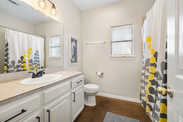 15100 General Williamson Dr, Austin, TX 78734 - bathroom with concrete flooring, toilet, vanity, baseboards, and a shower with curtain