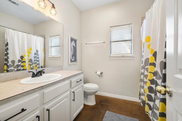 15100 General Williamson Dr, Austin, TX 78734 - full bathroom featuring concrete flooring, toilet, vanity, baseboards, and curtained shower