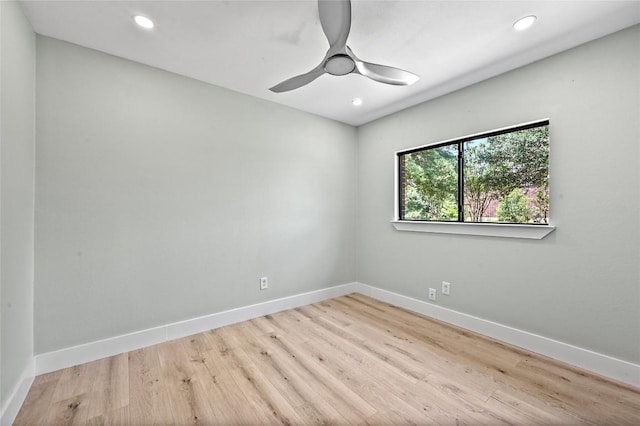 7065 Wheatfield Way, Kyle, TX 78640 - unfurnished room with a ceiling fan, wood finished floors, and recessed lighting