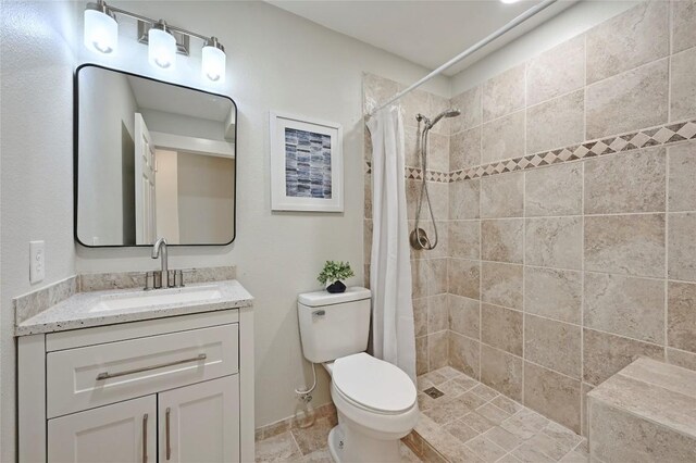 7065 Wheatfield Way, Kyle, TX 78640 - bathroom with vanity and tiled shower