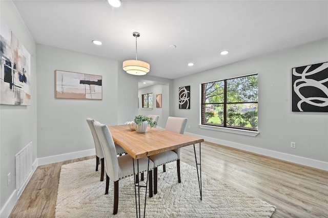 7065 Wheatfield Way, Kyle, TX 78640 - dining room with recessed lighting and wood finished floors