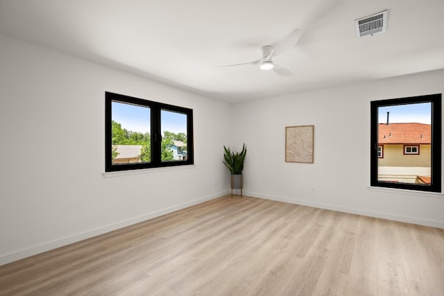 3809 Eton Ln, Austin, TX 78727 - unfurnished room featuring light wood-style floors, a ceiling fan, and baseboards