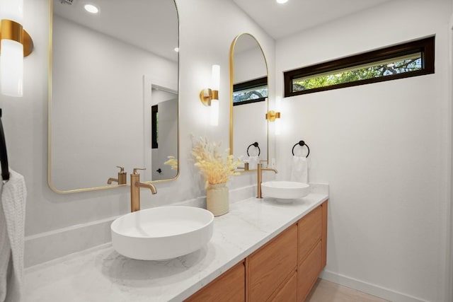 3809 Eton Ln, Austin, TX 78727 - full bathroom with double vanity and recessed lighting