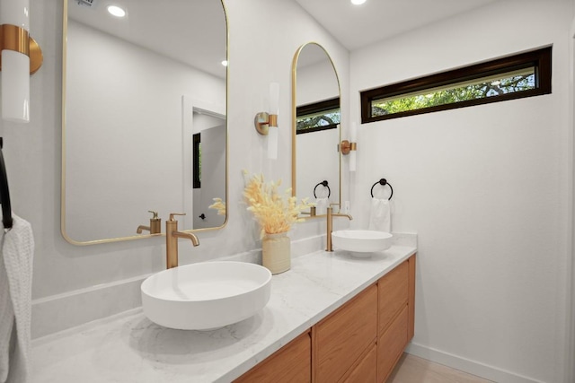 3809 Eton Ln, Austin, TX 78727 - bathroom featuring double vanity and recessed lighting