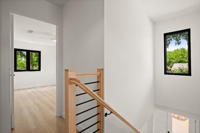 3809 Eton Ln, Austin, TX 78727 - stairway featuring plenty of natural light and wood finished floors