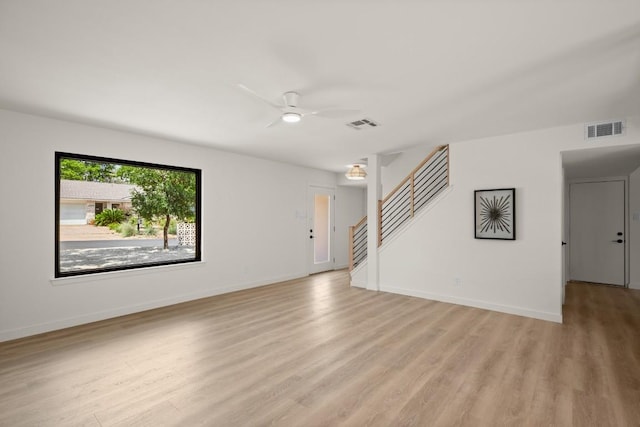 3809 Eton Ln, Austin, TX 78727 - spare room with light wood-type flooring, a ceiling fan, stairway, and baseboards