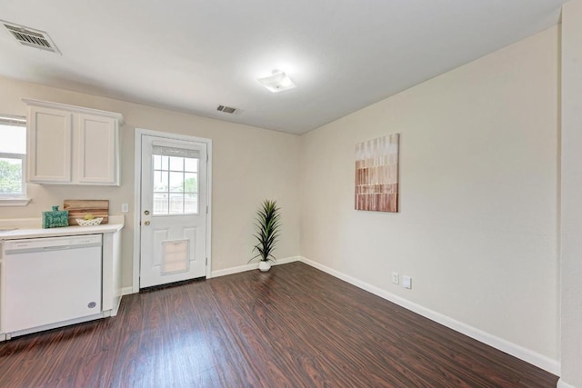 1101 Winecup Ct, Leander, TX 78641 - unfurnished dining area featuring dark wood finished floors, healthy amount of natural light, and baseboards