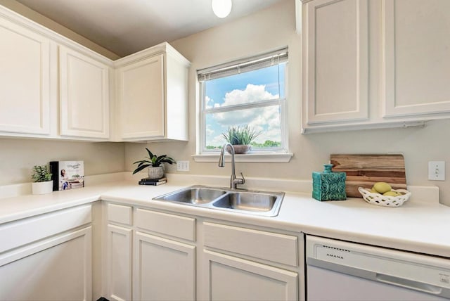 1101 Winecup Ct, Leander, TX 78641 - kitchen featuring white dishwasher, a sink, white cabinetry, and light countertops