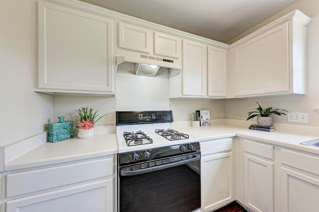 1101 Winecup Ct, Leander, TX 78641 - kitchen featuring gas range oven, under cabinet range hood, white cabinets, and light countertops