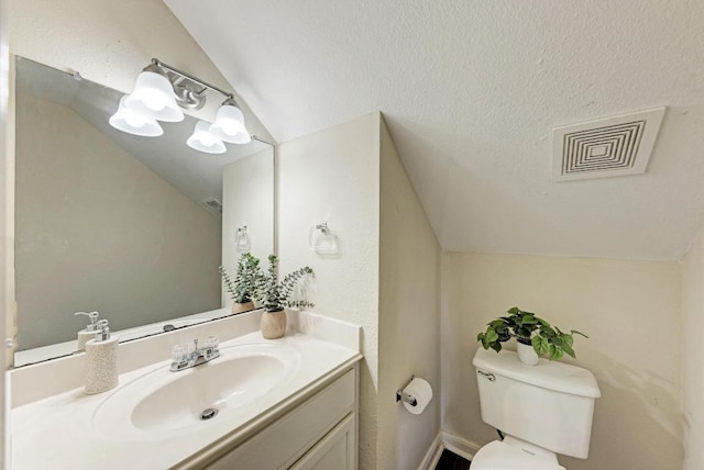 1101 Winecup Ct, Leander, TX 78641 - half bathroom with vaulted ceiling, vanity, and toilet
