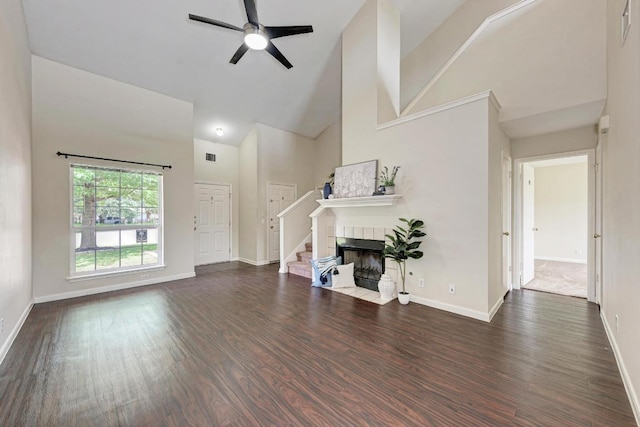 1101 Winecup Ct, Leander, TX 78641 - living room with high vaulted ceiling, baseboards, dark wood finished floors, a ceiling fan, and stairway